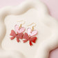 Heart and bow acrylic earrings
