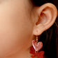 Heart and bow acrylic earrings