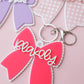 Scallop bow backpack name tag