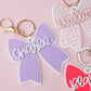 Scallop bow backpack name tag