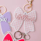 Scallop bow backpack name tag