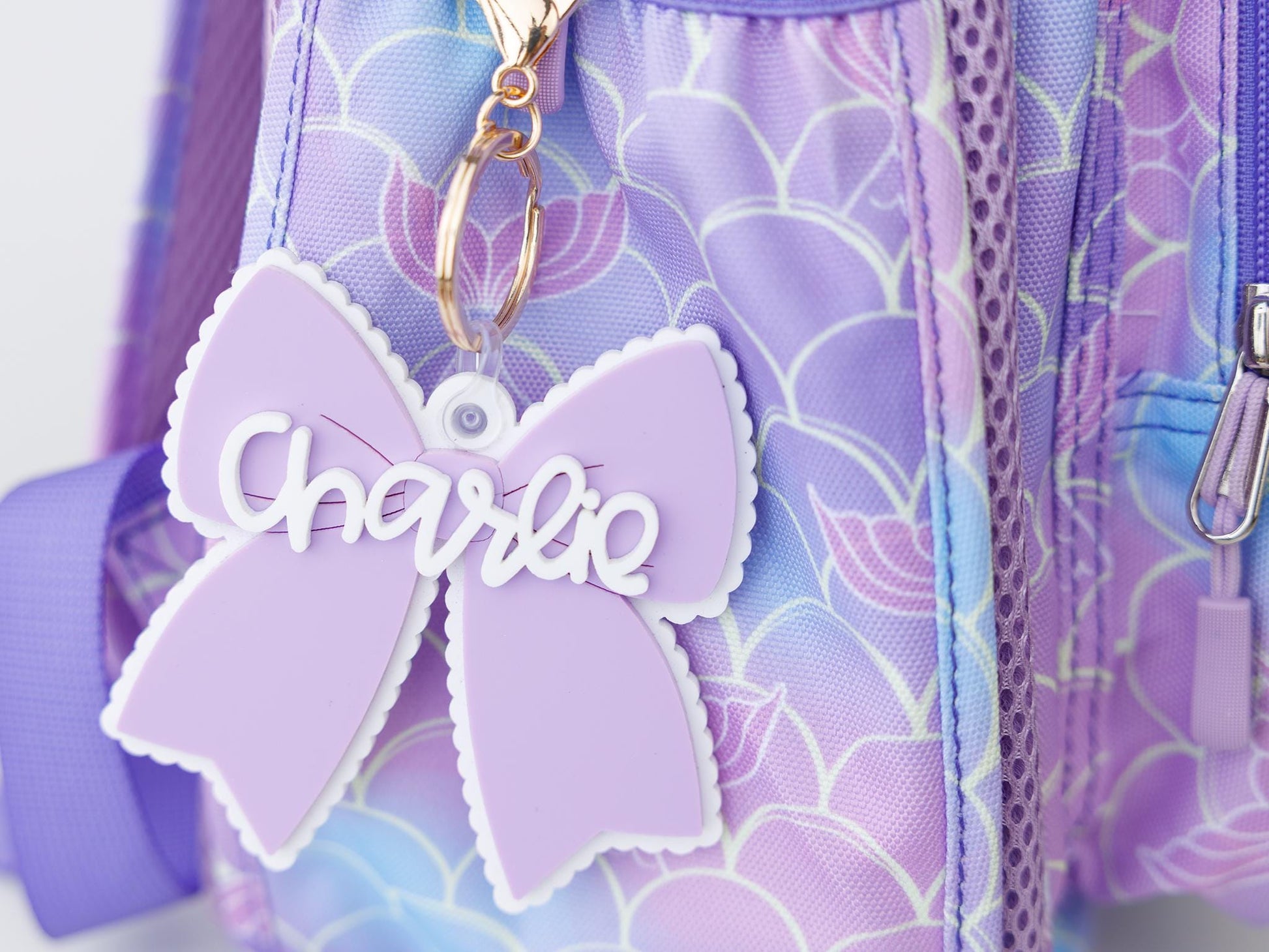 Scallop bow backpack name tag